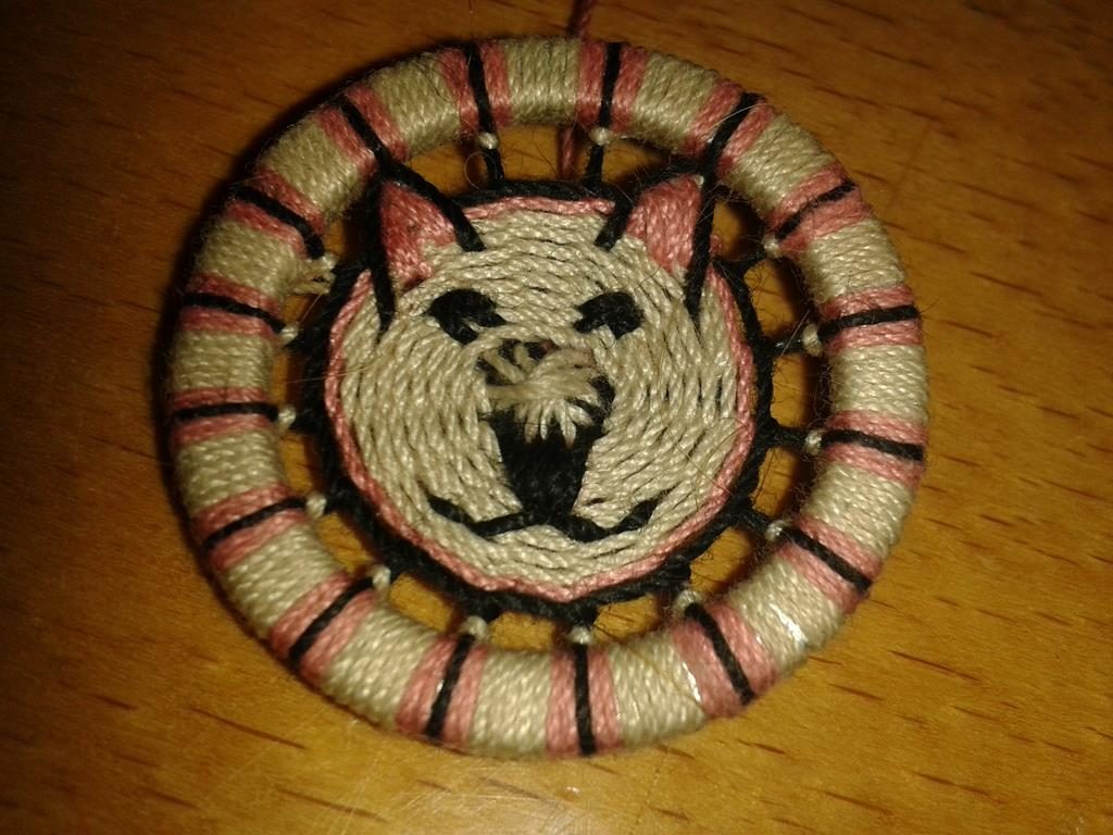 Zwirnknopf mit Tiergesicht
